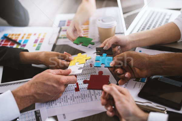 Teamwork of partners. Concept of integration and startup with puzzle pieces Stock photo © alphaspirit