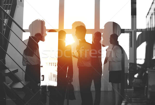 Businessmen that work together in office. Concept of teamwork and partnership. double exposure Stock photo © alphaspirit