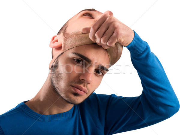 Teenager with adult mask Stock photo © alphaspirit