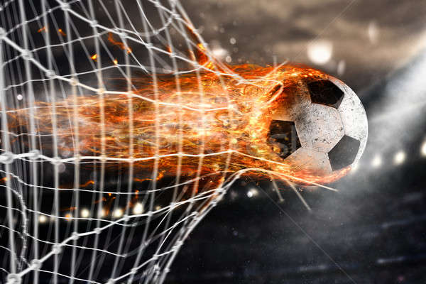 Soccer fireball scores a goal on the net Stock photo © alphaspirit