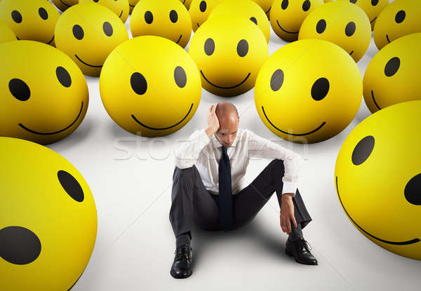 Alone desperate businessman in the middle of happy smileys . 3D Rendering Stock photo © alphaspirit