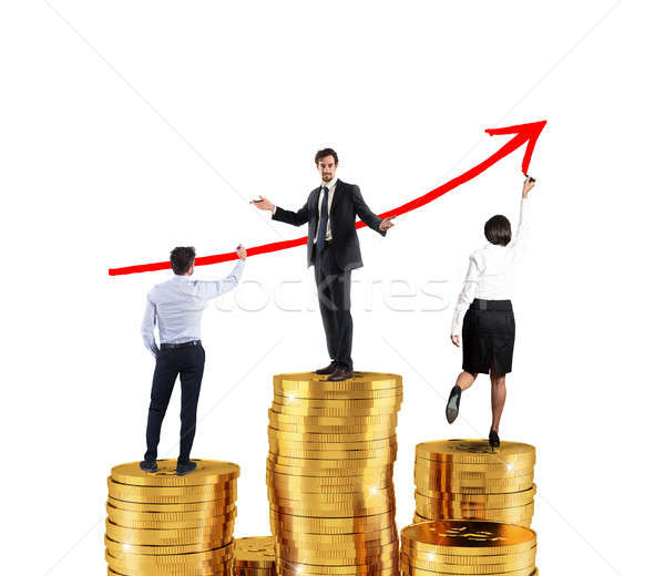 Business team draws growing arrow of company statistics over the piles of money Stock photo © alphaspirit