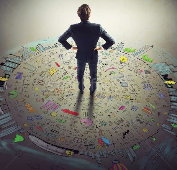 Businessman thinks business world Stock photo © alphaspirit