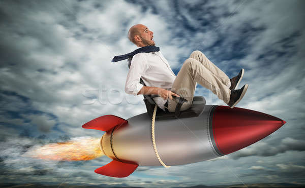 Wachstum klettern Erfolg Geschäftsmann unter Rakete Stock foto © alphaspirit