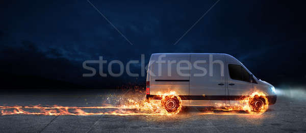 Super fast delivery of package service with van with wheels on fire Stock photo © alphaspirit