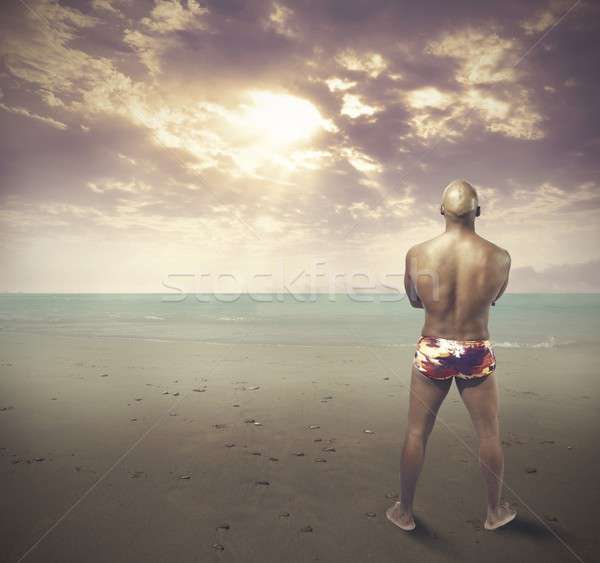 Homem negro praia céu homem luz verão Foto stock © alphaspirit
