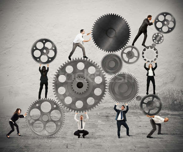 Teamwork of businesspeople Stock photo © alphaspirit