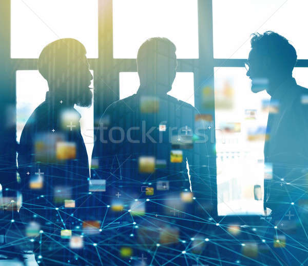 Businessmen that work together in office with network connection effect. Concept of teamwork and par Stock photo © alphaspirit