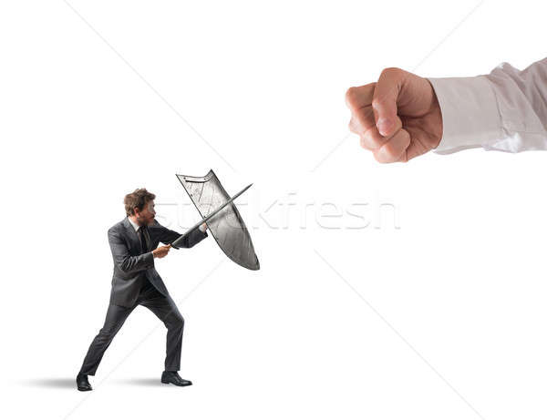 Little business man challenges big problems fighting with shield and sword Stock photo © alphaspirit