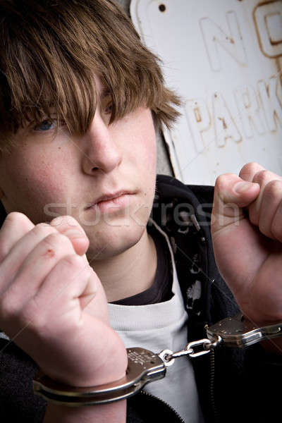 Genç kelepçe suç tutuklama eller çocuk Stok fotoğraf © alptraum