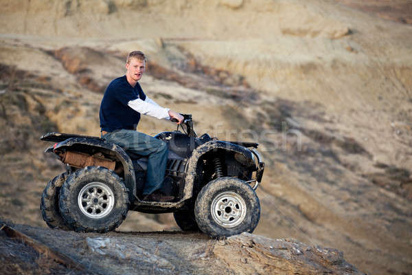 teen on quad ATV in the hills Stock photo © alptraum