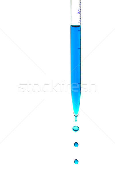 Caer gotas azul líquido aislado blanco Foto stock © Alsos