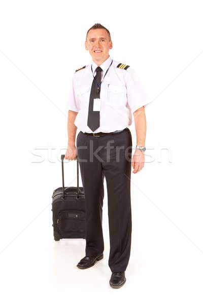 Companhia aérea piloto alegre uniforme em pé Foto stock © Amaviael