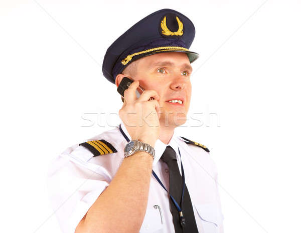 Légitársaság pilóta telefon derűs visel egyenruha Stock fotó © Amaviael