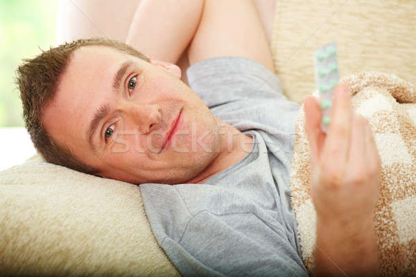 Beteg férfi drogok hideg fektet kanapé Stock fotó © Amaviael
