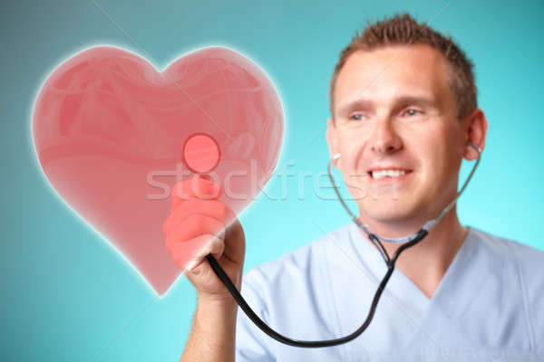 Medicine doctor with holographic heart Stock photo © Amaviael