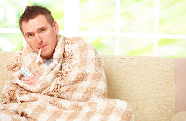男子 發燒 冷 坐在 沙發 商業照片 © Amaviael