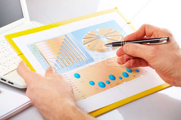 Business graphs and male hands Stock photo © Amaviael