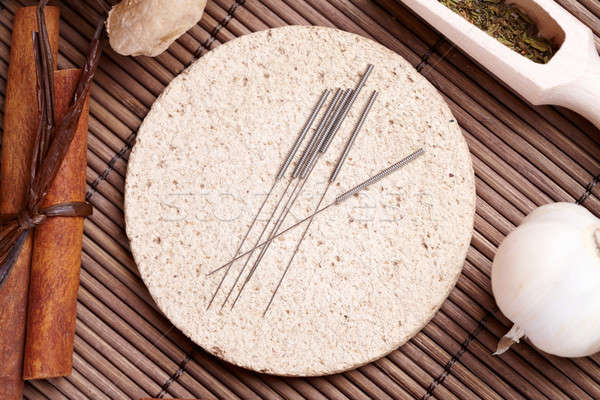 Stock photo: Acupuncture needles and TCM herbs