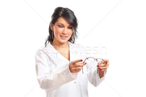 Optician woman giving glasses Stock photo © Amaviael