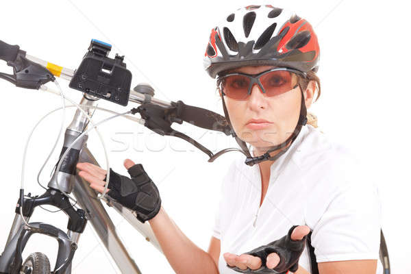 Troubled girl cyclist with her bike Stock photo © Amaviael