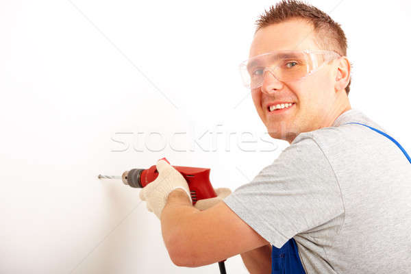 Man drilling hole Stock photo © Amaviael