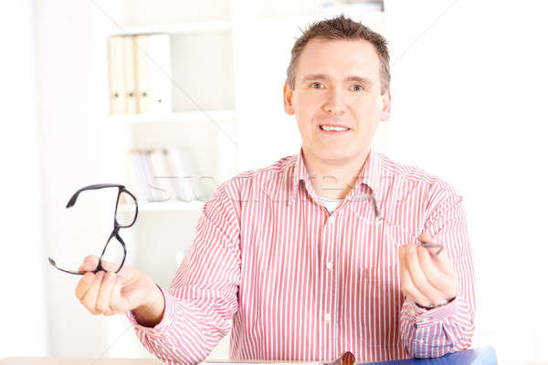 Optician presenting glasses Stock photo © Amaviael