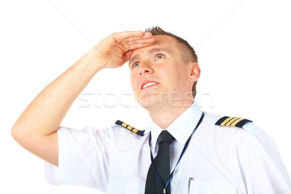 Airline pilot looking upwards Stock photo © Amaviael