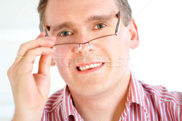 Man taking off glasses Stock photo © Amaviael
