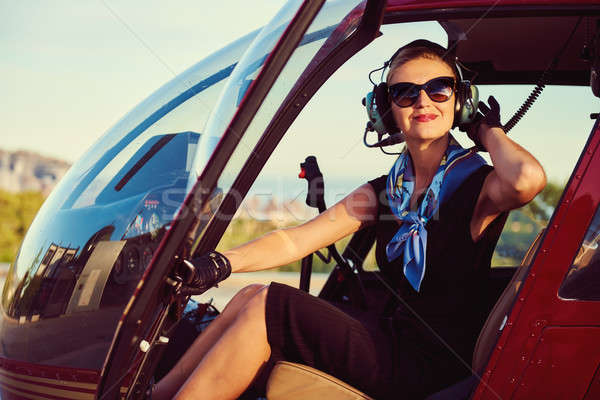 Vonzó nő pilóta ül helikopter mosoly munka Stock fotó © amok