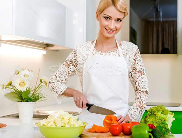 Smiling young woman preparing vegetarian salad Stock photo © amok