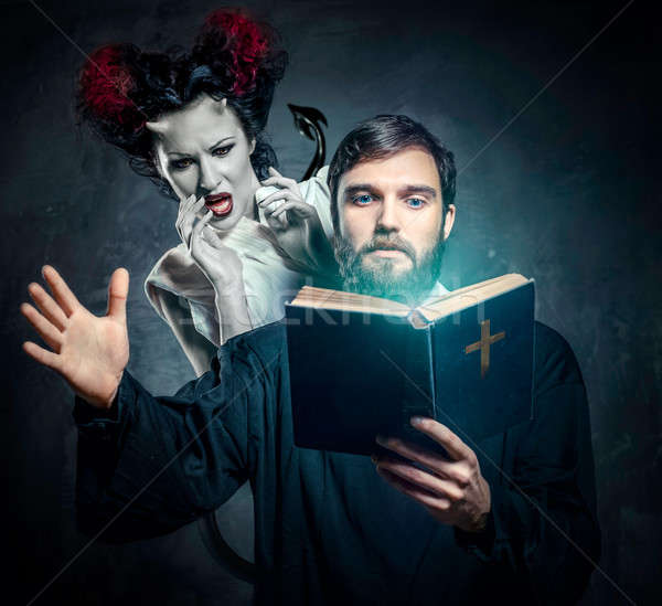 Priest evicting demons, conceptual photo Stock photo © amok