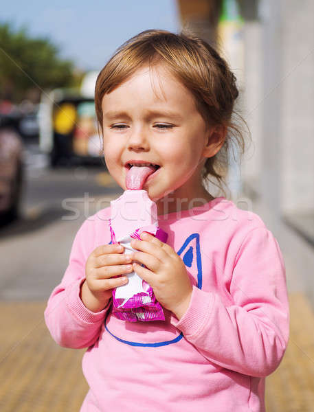 Little girl licking an ice cream Stock photo © amok