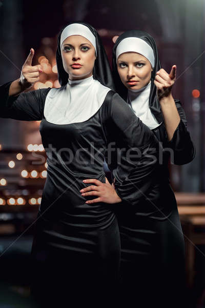 Attractive young nuns posing in the church Stock photo © amok