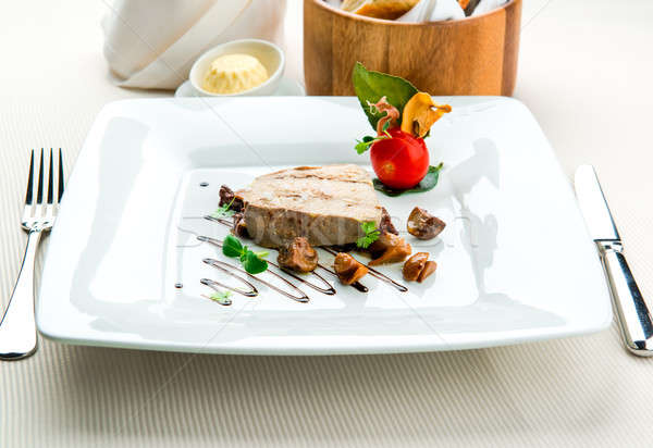 Sliced foie gras with sauce and chanterelle mushrooms  Stock photo © amok