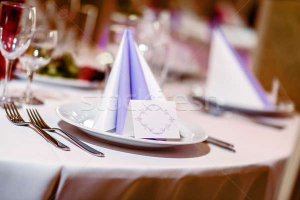 Wedding table decoration. Folded napkin, place card and crockery Stock photo © amok