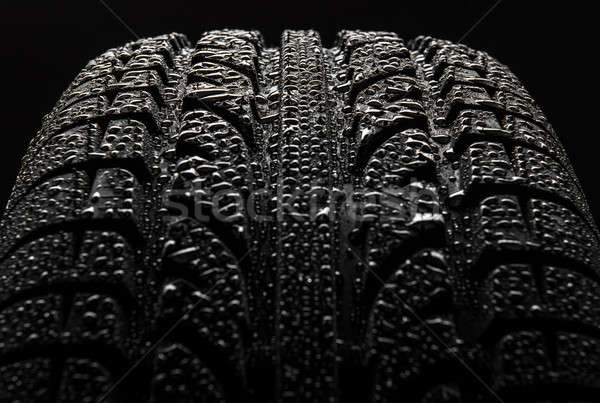 Tire with water drops over black background Stock photo © amok