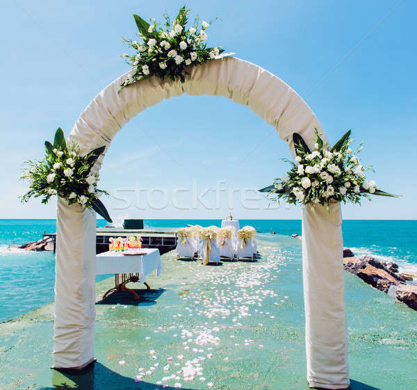 Wedding arch and wedding chairs on the empty beach Stock photo © amok