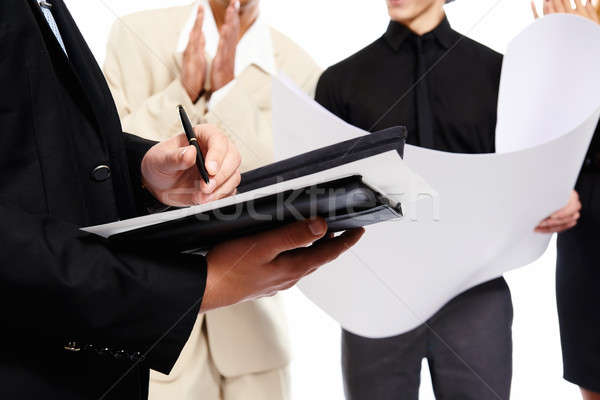 Signing a document. People at business meeting. Studio shot Stock photo © amok