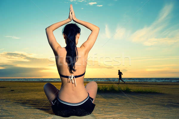 Woman doing yoga exercise outdoors Stock photo © amok