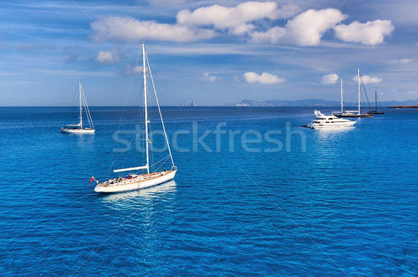 Early morning in in Formentera. Sailboats at Cala Saona bay Stock photo © amok