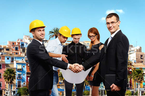 Gente de negocios apretón de manos hasta reunión construcción Foto stock © amok