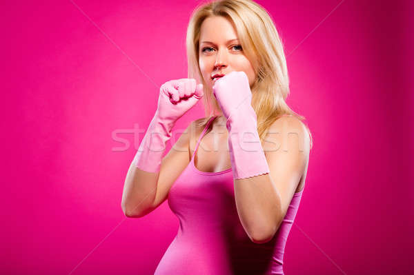 Pregnant attractive woman wearing rubber gloves posing over pink Stock photo © amok