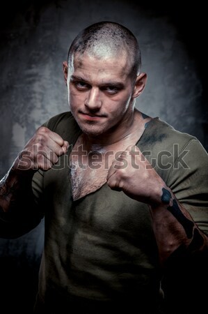 Musculaire jeune homme beaucoup tatouages posant gris [[stock_photo]] © amok