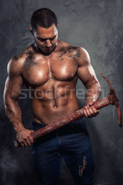 Muscular man holding pickaxe Stock photo © amok