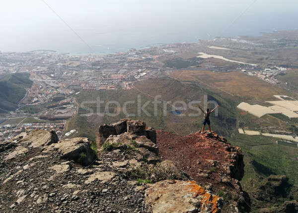 Woman on a top of a mountain enjoying valley view Stock photo © amok