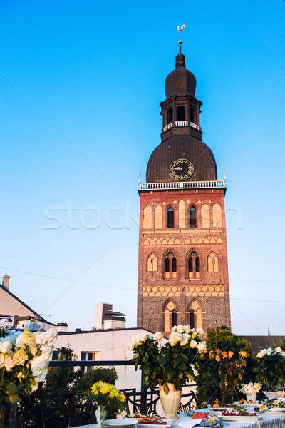 Wedding table against St. Peter's church in Riga, Latvia Stock photo © amok