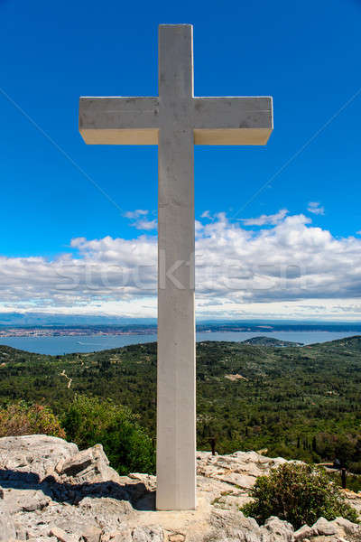 White cross against blue sky and fluffy clouds Stock photo © amok