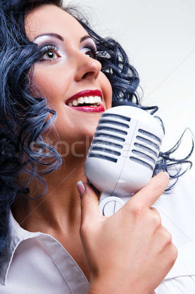 Beautiful young brunette singing Stock photo © amok