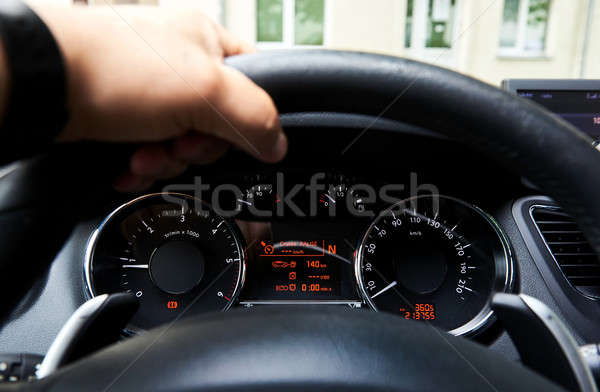 Driver's hand on a steering wheel inside of a car Stock photo © amok